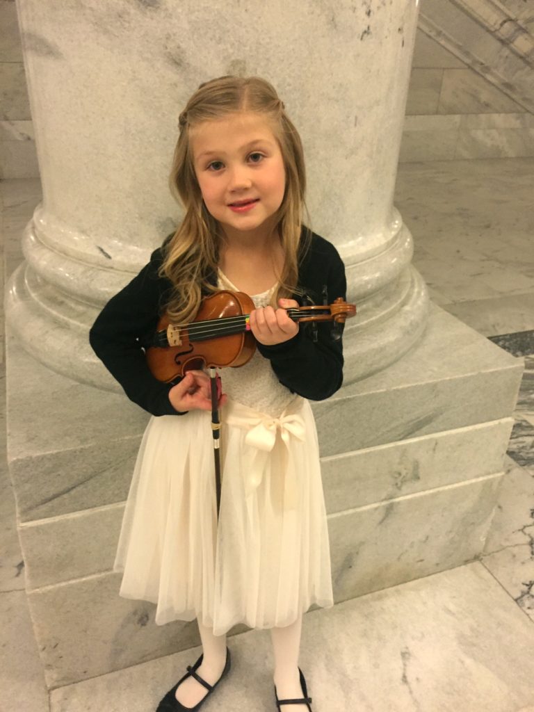 Makena playing her violin.